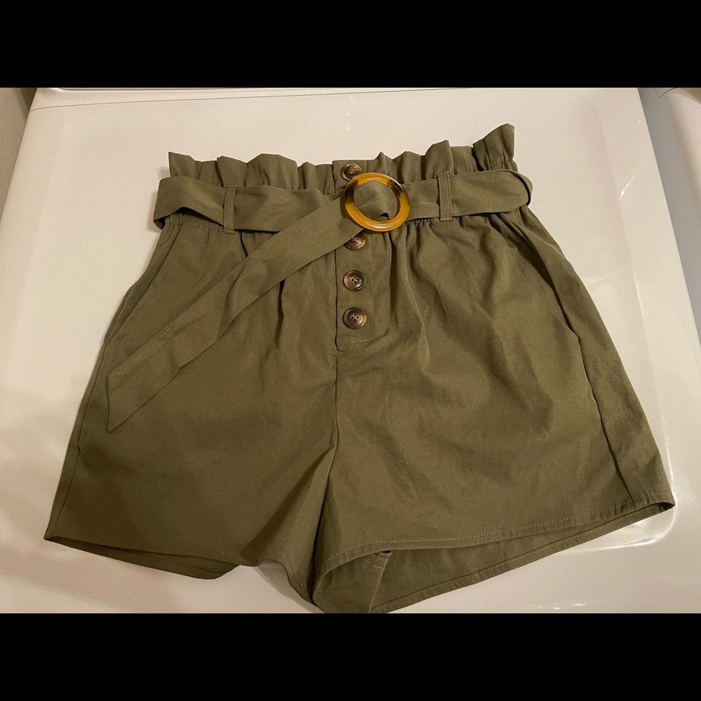Clean slate belted high waisted paperbag shorts. Olive green